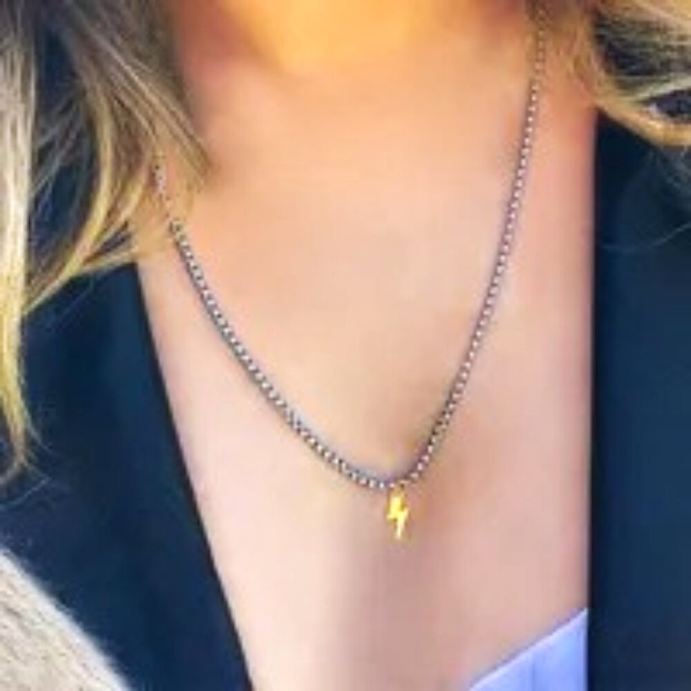 STAINLESS STEEL ROPE NECKLACE WITH 18K GOLD DIPPED THUNDERBOLT PENDANT